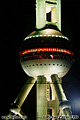 Close-up of the lower section of the Oriental Pearl radio and TV tower. If you look closely you will notice a section of a sky-crane just below the sphere. The crane was in use building a shopping mall at the time this photo was taken (about 10:25pm). 'Minolta X-700 35mm SLR' (Click for larger view)