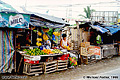 This colorful fruit stand was located along the road in Cavite. Cavite, Philippines 'Minolta X-700 35mm SLR' (Click for larger view)